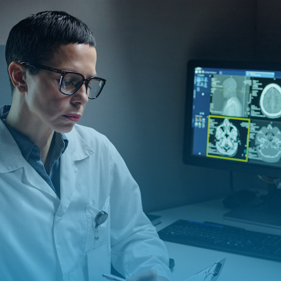 A doctor reviewing brain scans